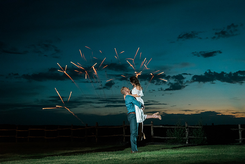 Romantic couple in front of fireworks